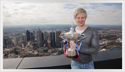 Neil Robertson with World Championship trophy on top on Eureka Tower